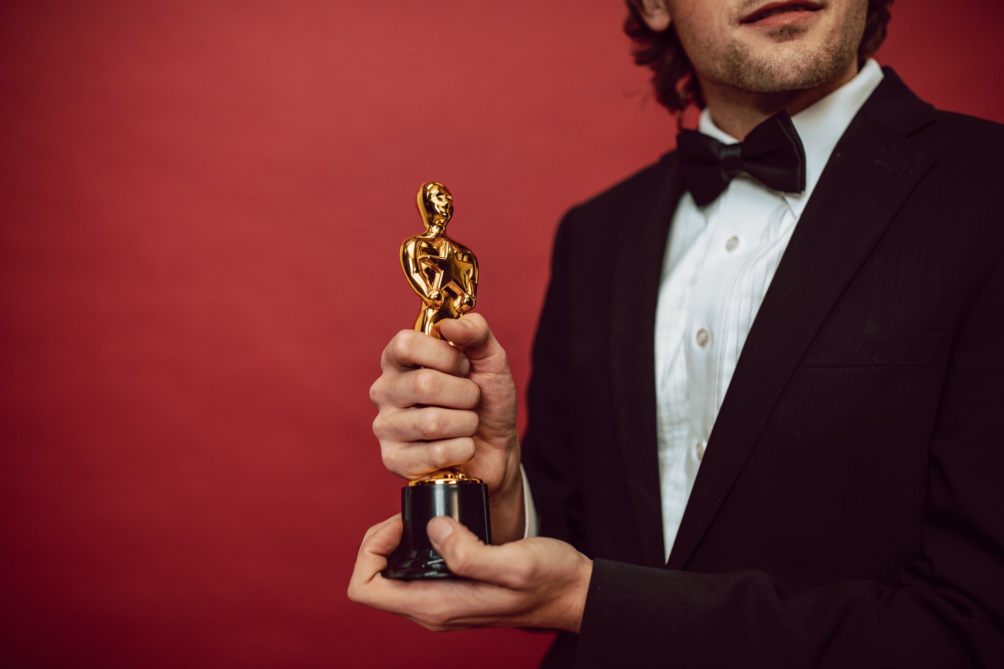 An Actor Holding His Award